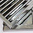 Folded stainless grate in tray